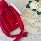 Red bobble hat